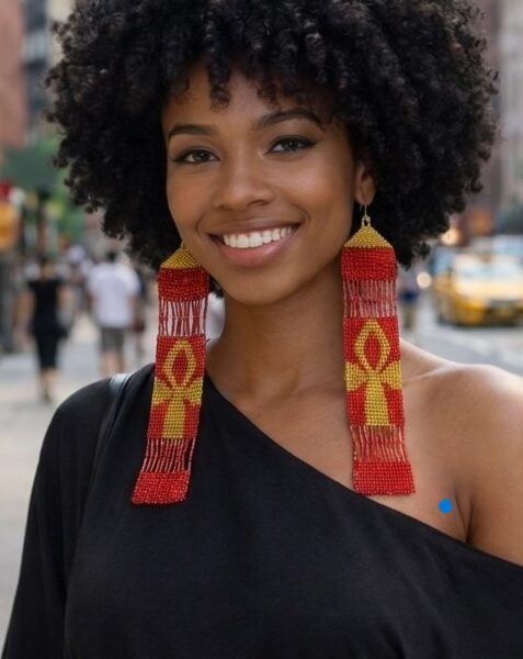 Ankh red and gold on woman wearing black blouse