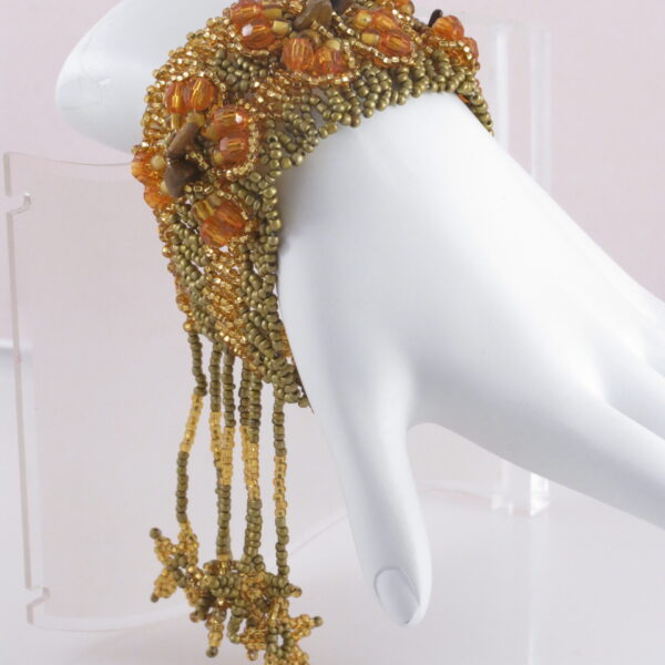 Handmade golden brown beaded fringe cuff bracelet.
